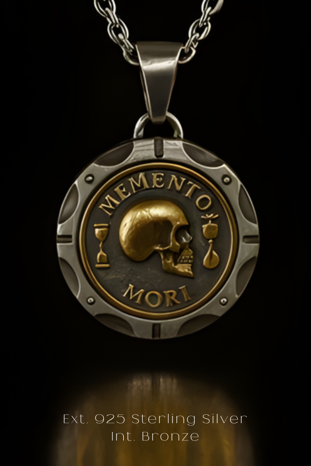 a pendant with a skull design and the Latin phrase "Memento mori" on it, which translates to "Remember this day" in English. The pendant is made of silver and has a chain attached to it.