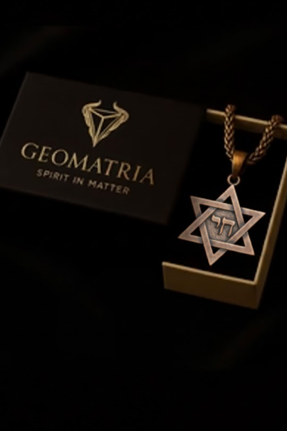 a pendant with a Star of David and a box with the word "Geomatria" written on it.