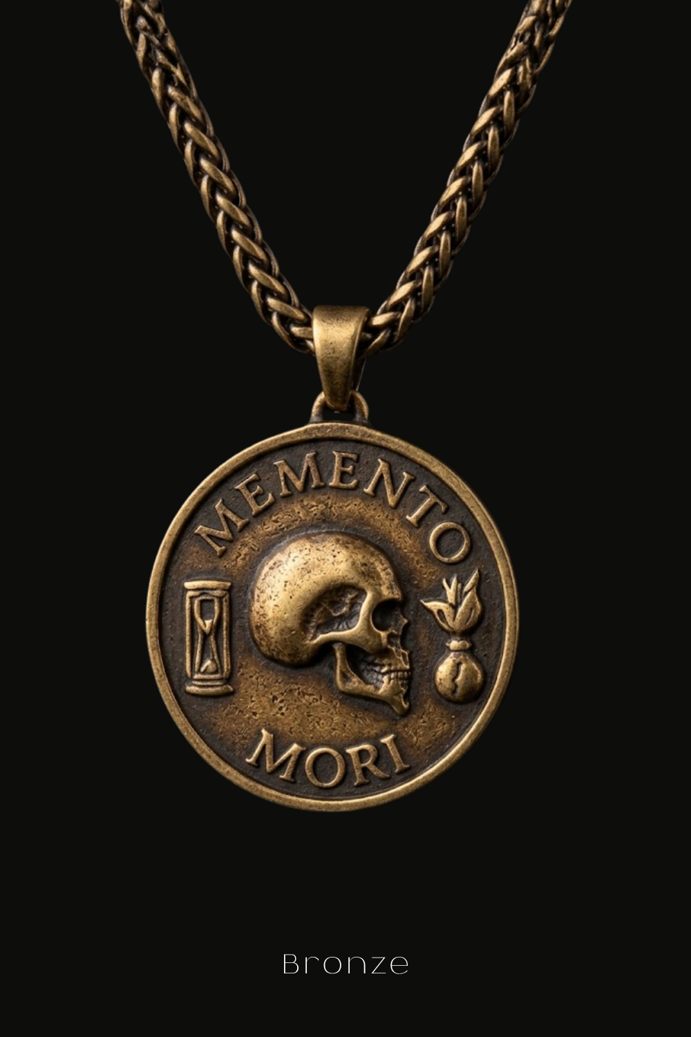 A bronze pendant necklace with a circular medallion featuring a skull and the Latin phrase "Memento mori" (The Memory of Death).