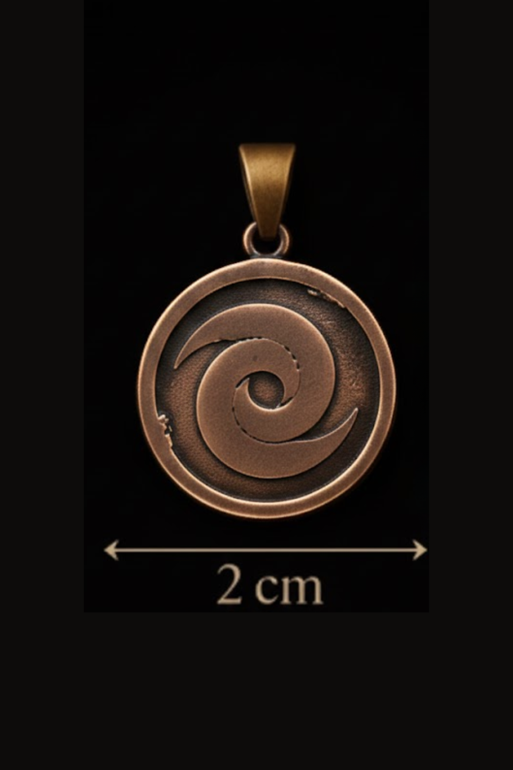 A copper-colored pendant with a spiral design, against a black background.