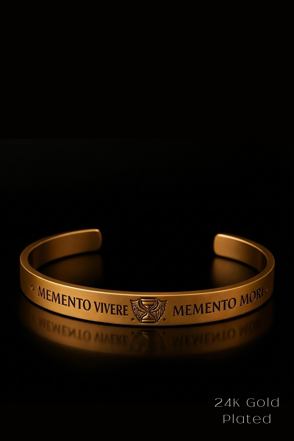 A gold-plated bracelet with the text "MEMENTO VIVERE MEMENTO MORI" engraved on it, which translates to "Memento, here is a reminder" in Latin.