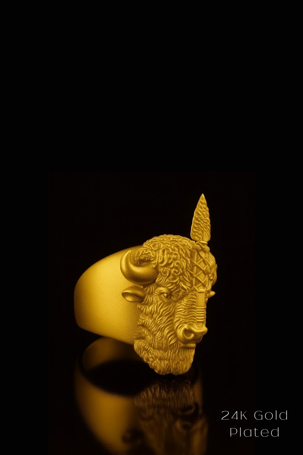 A gold ring featuring a detailed buffalo head design against a black background.