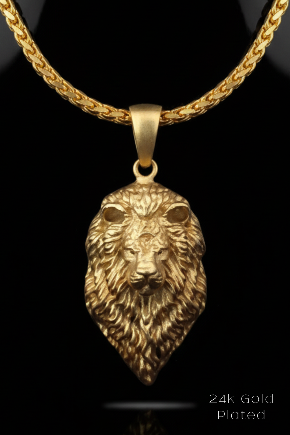 A 24k gold plated pendant featuring a detailed lion's head design.