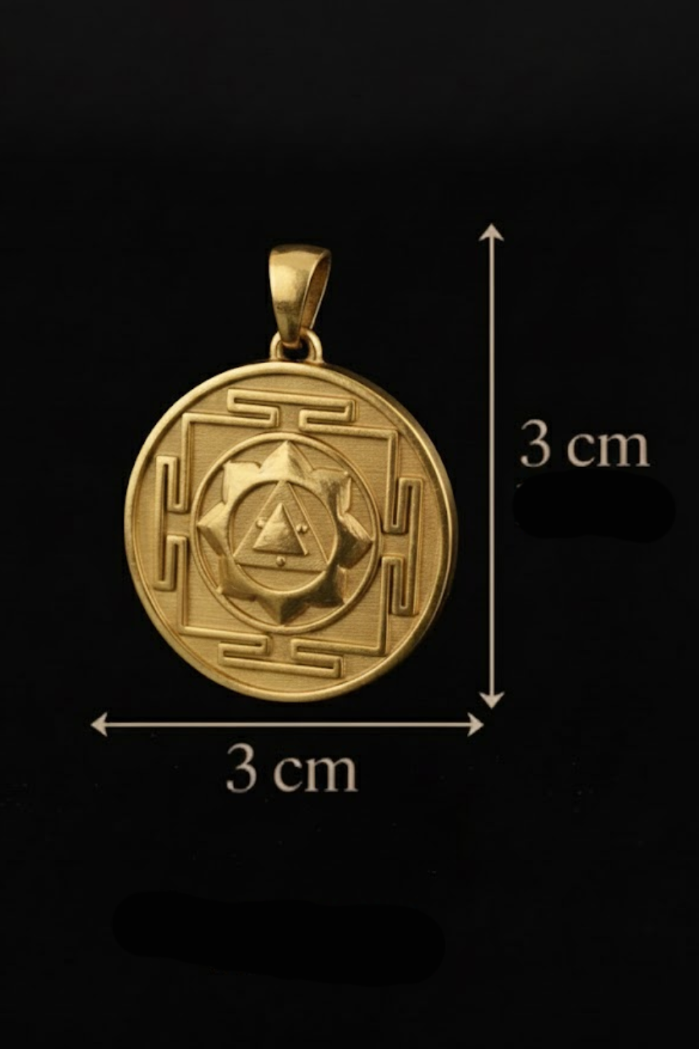 A gold-colored pendant with a geometric design, possibly a symbol or emblem, is shown against a black background.