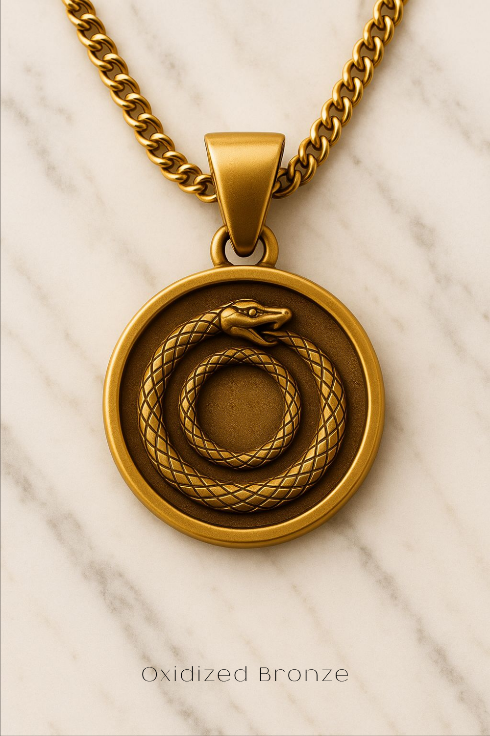 A gold-colored pendant necklace with a circular design featuring a snake and a snake coiled around each other.