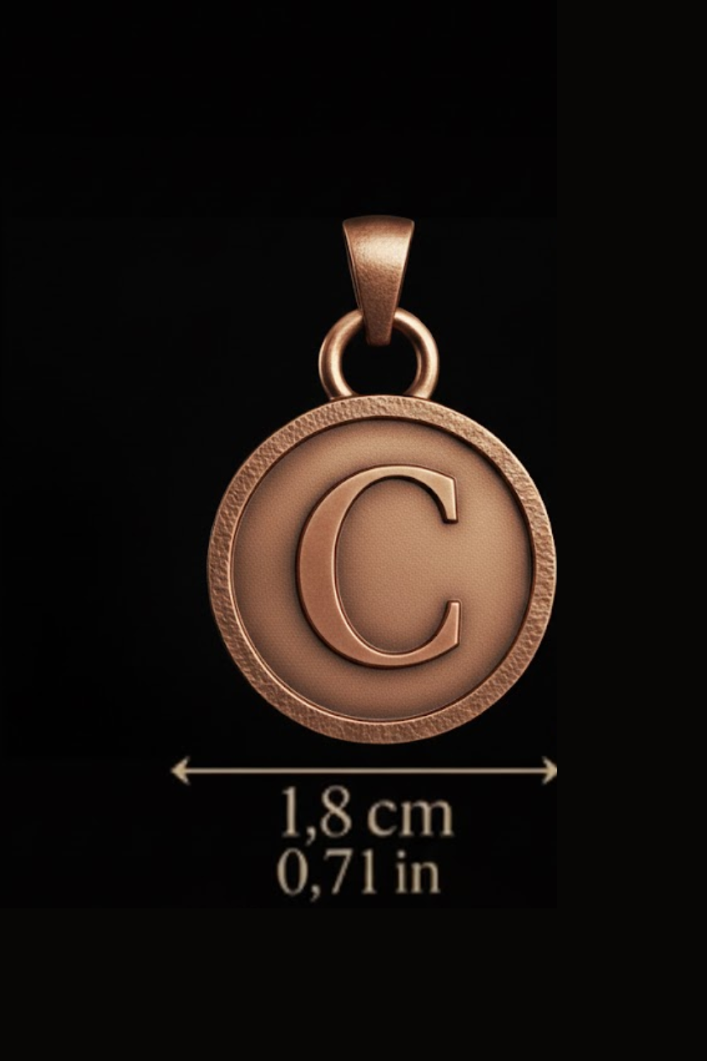 a large, round, copper-colored pendant with the letter 'C' on it.