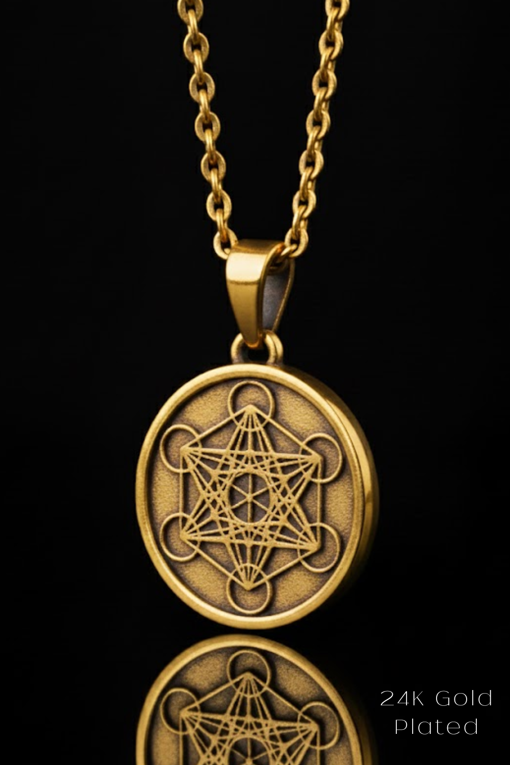 A gold-colored pendant necklace with a circular medallion featuring a geometric design.