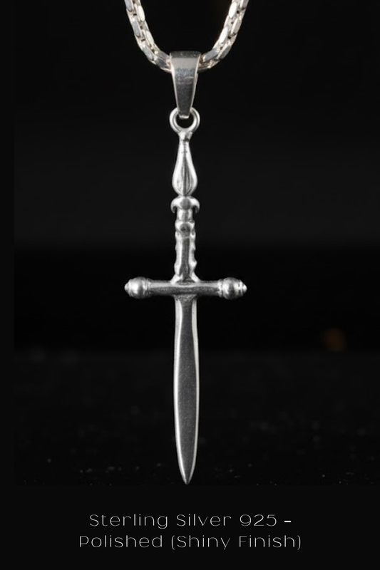 A silver-colored pendant in the shape of a sword, suspended from a chain against a black background.