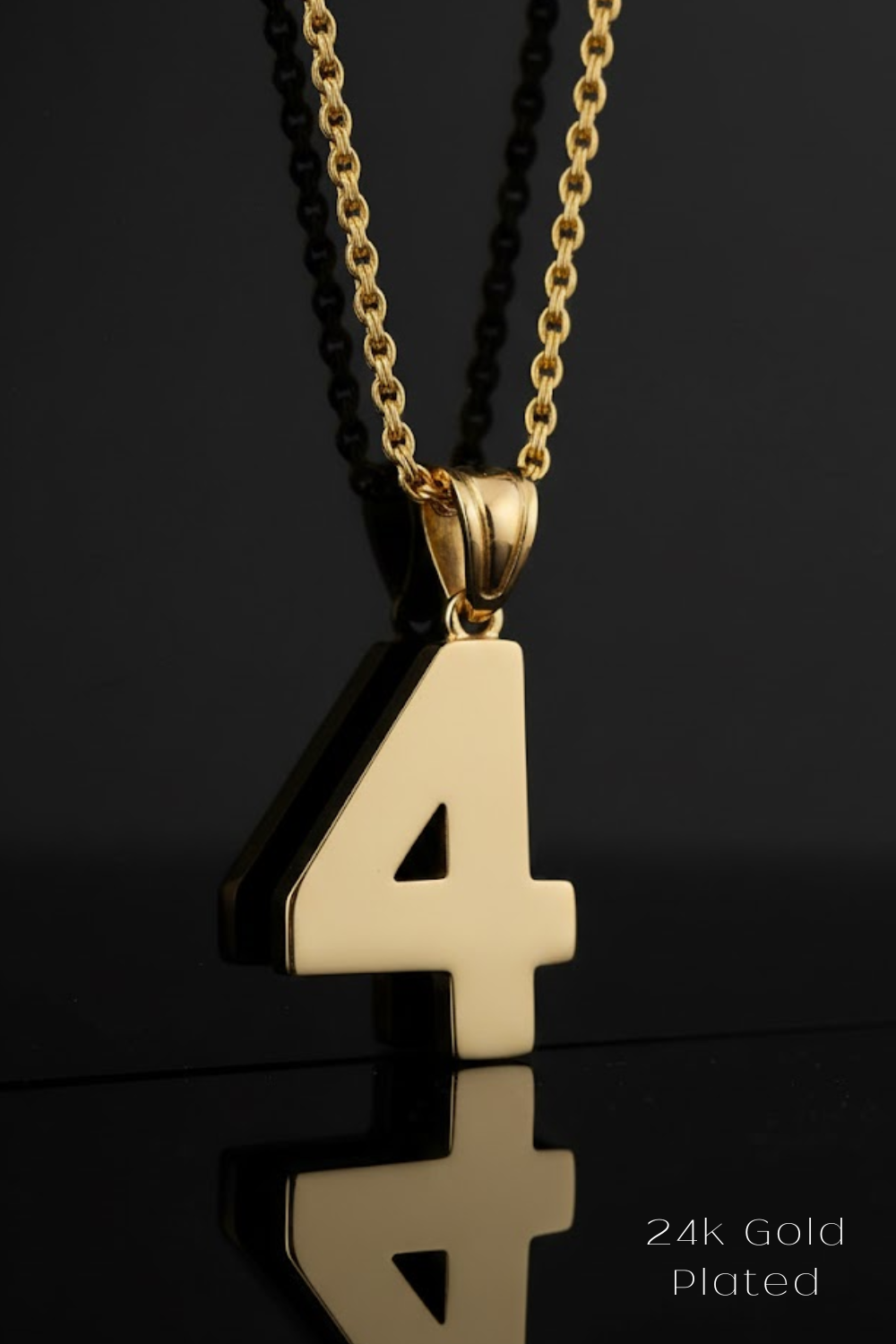 A 24k gold-plated pendant necklace with the number 4 prominently displayed.
