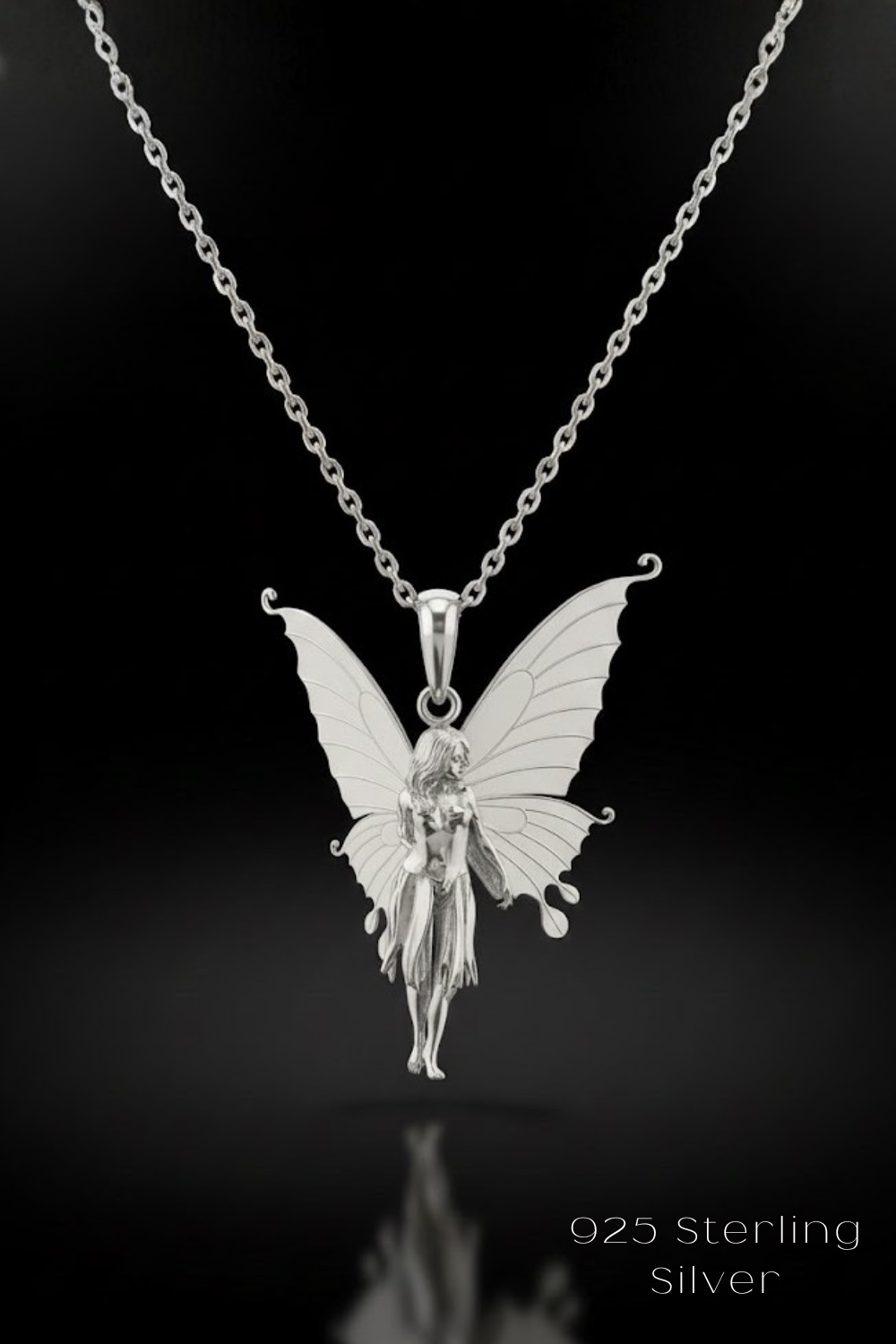 A silver pendant necklace with a silver fairy figure on a silver chain.