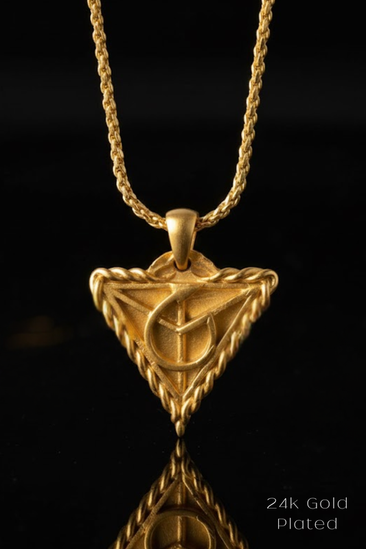 A gold-plated pendant necklace with a triangular pendant featuring a symbol or design.