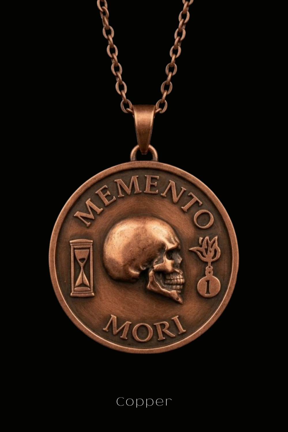 a copper-colored pendant necklace with a circular medallion featuring a skull and the words "MEMENTO MORI" (Memento mori) inscribed on it.
