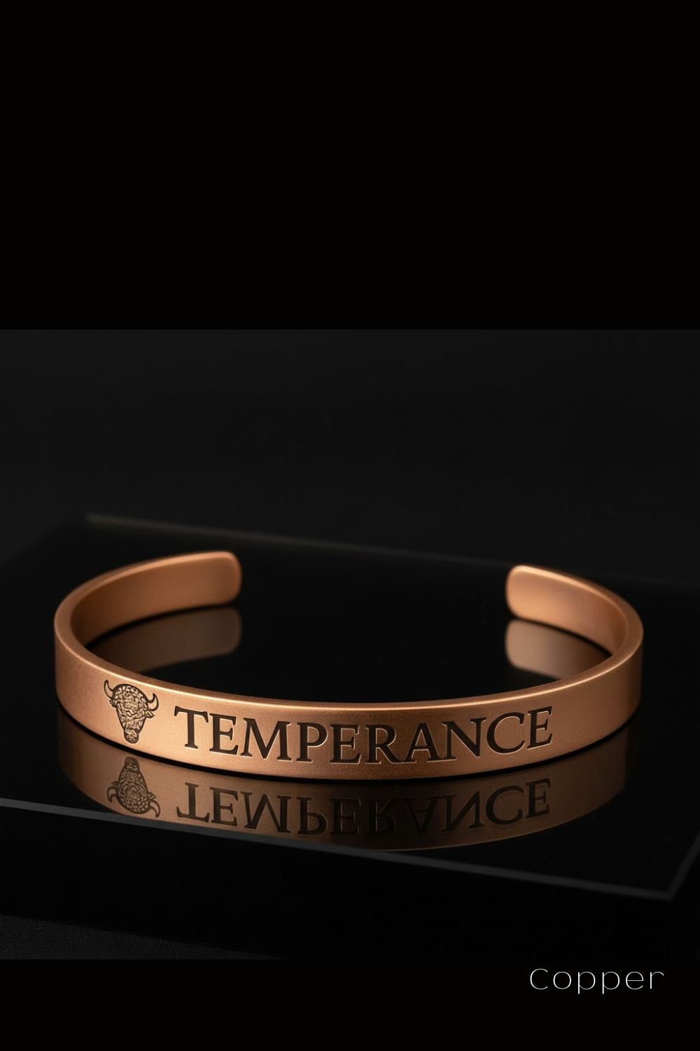 A copper bracelet with the word "TEMPERANCE" engraved on it, displayed against a black background.