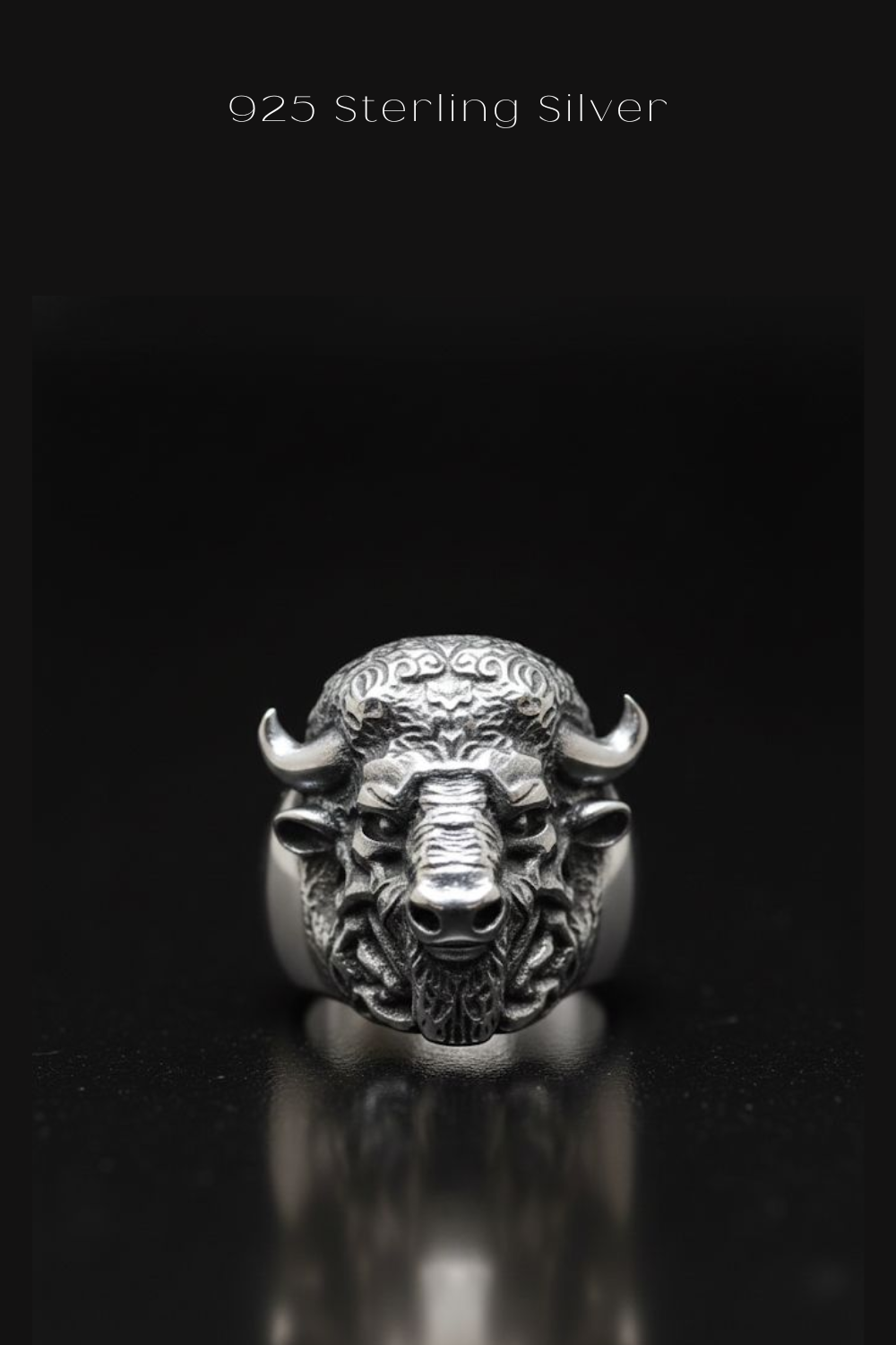 A silver ring featuring a detailed buffalo head design against a black background.