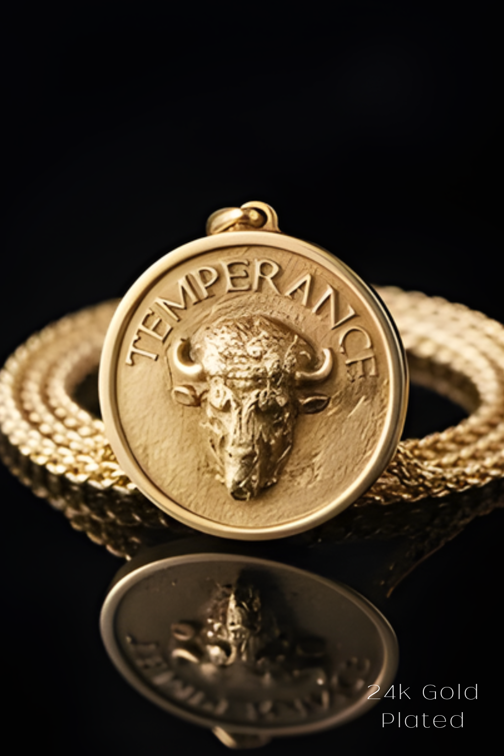 A 24K gold plated pendant featuring a bull's head design, with the text "TEMPERANCE" inscribed around the edge.