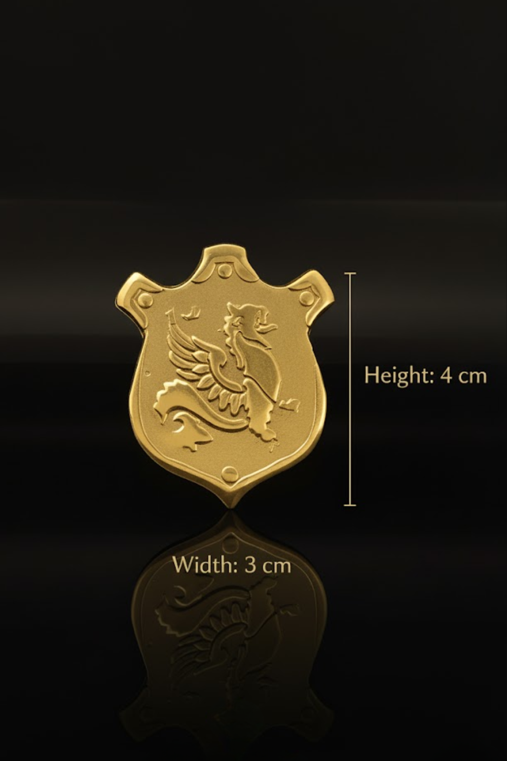 A golden shield-shaped object with a winged creature design, placed on a reflective surface against a black background.